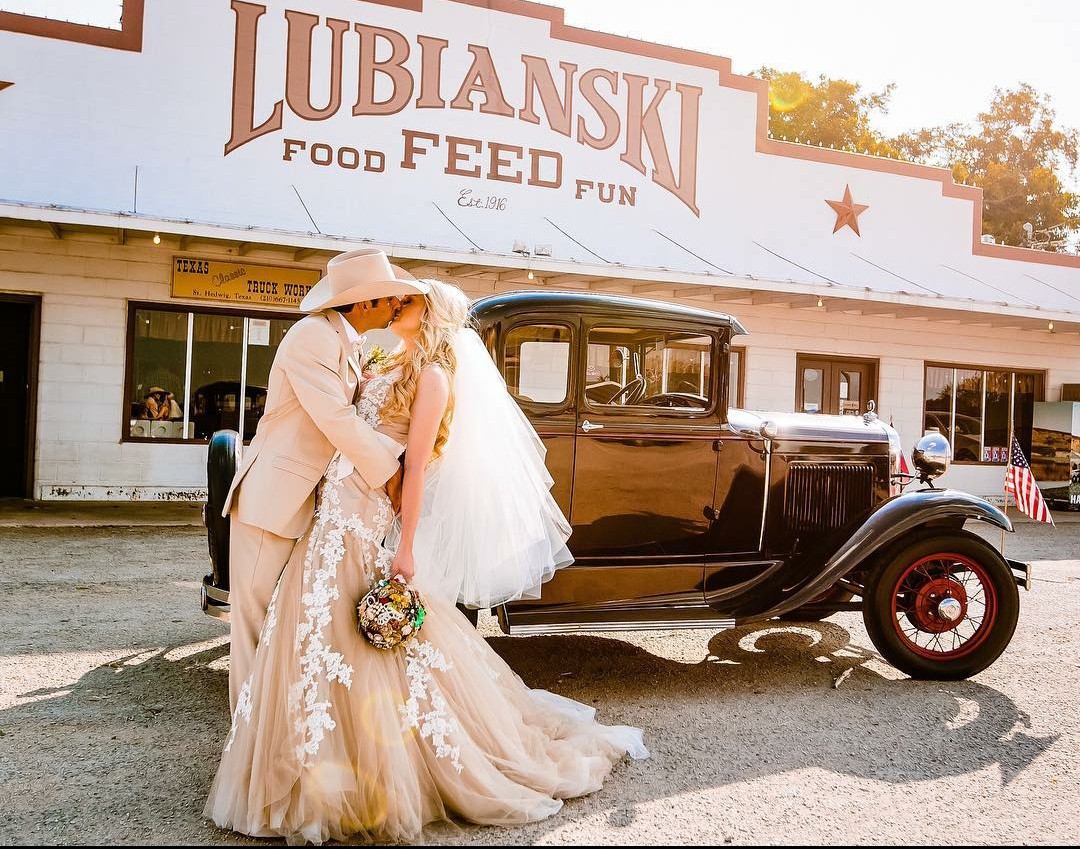 A wedding celebration in front of the Lubianski storefront