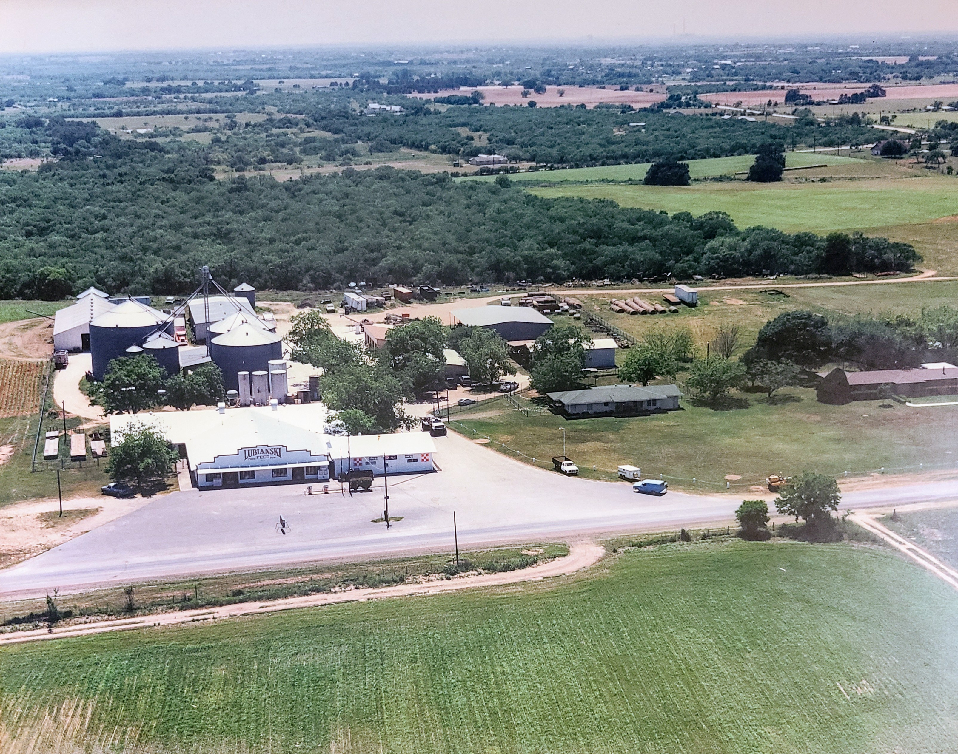 Aerial view of the Lubianski Grain Company store, feed mill, and silos