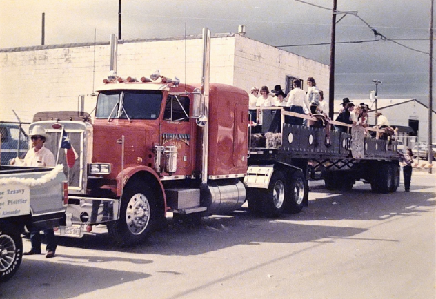 A row of vintage Lubianski delivery trucks